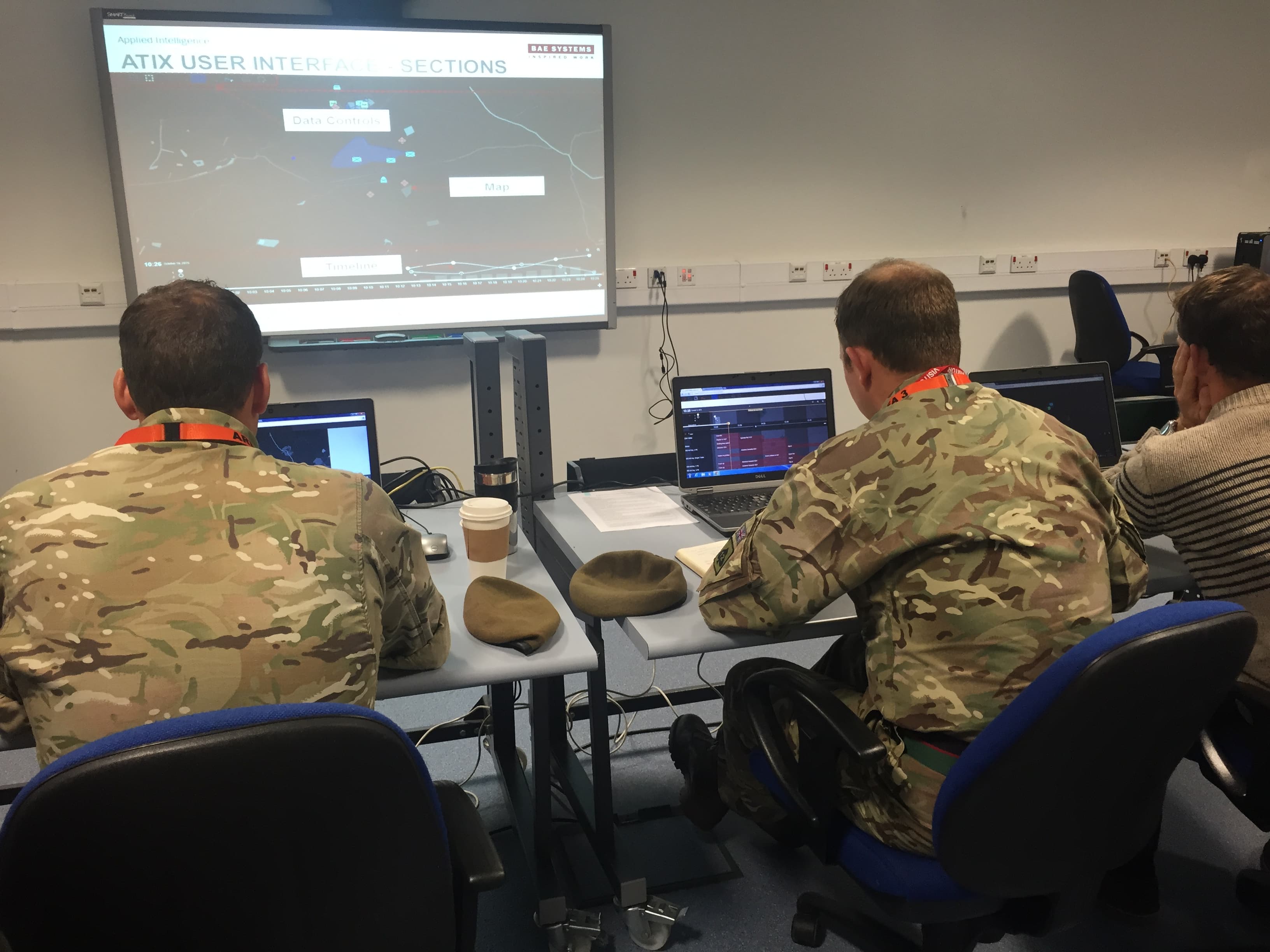 British Army soldiers in uniform testing the ATIX interface during a usability evaluation session