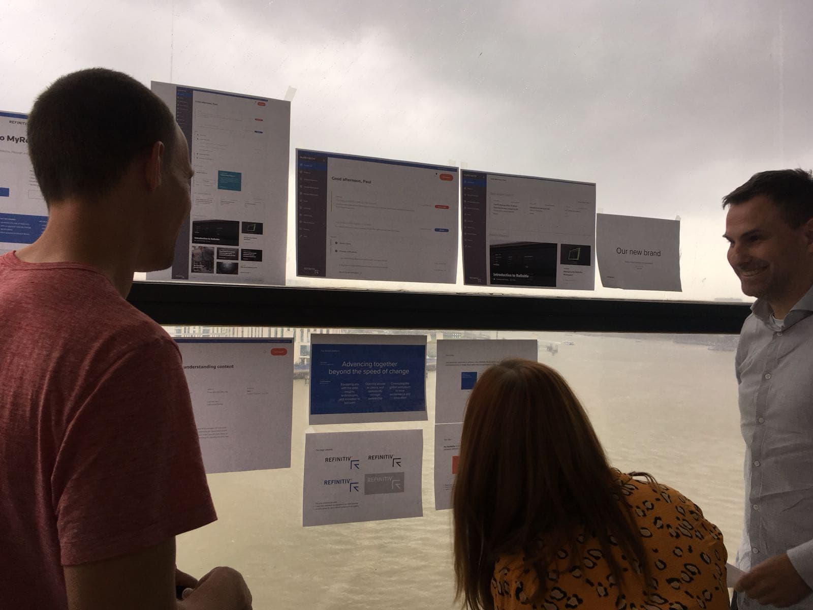 Design review session for MyRefinitiv - team reviewing interface designs on screen